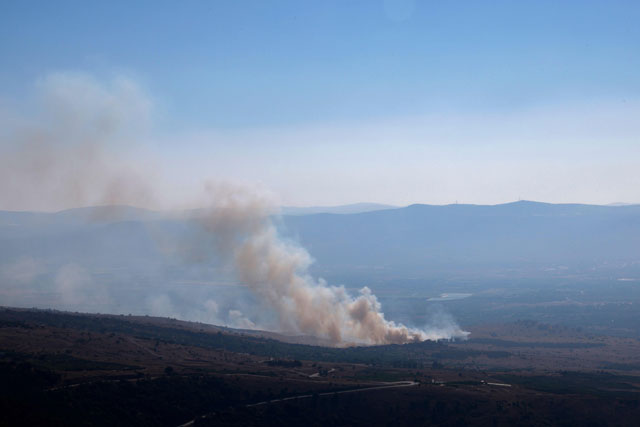 Smoke billows after a hit from a rocket fired from southern Lebanon over the Upper Galilee region in northern Israel on Sunday (AFP photo)