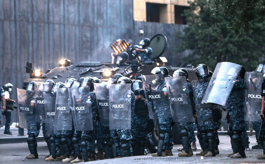 Lebanese security forces stand with riot shields during clashes with protesters amidst an anti-government demonstration in the centre of Lebanon's capital Beirut on Tuesday (AFP photo)