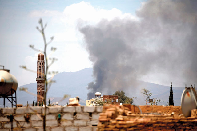 Smoke billows following an air-strike by the Saudi-led coalition targeting Al Dailami airbase, in the capital Sanaa, on Thursday (AFP photo)