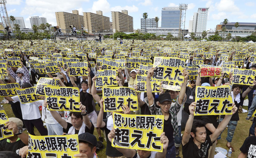 Protesters hold placards that read: ‘Our anger has reached its limit’ during a protest rally against the presence of US military bases on the southwestern island of Okinawa in Naha, Okinawa, on Sunday (AP photo)