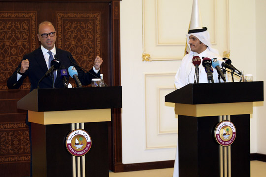 Italian Foreign Minister Angelino Alfano and Qatar's Foreign Minister Sheikh Mohammed Bin Abdulrahman Al Thani attend a joint news conference in Doha, Qatar, on Wednesday (Reuters photo)