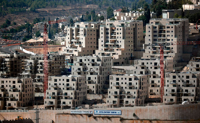 Buildings are seen under construction on Tuesday at the Israeli settlement of Ramot, situated in a neighbourhood of East Jerusalem annexed by Israel but not recognised internationally (AFP photo)