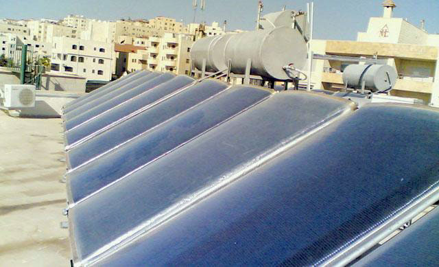   Solar cells are installed to houses of beneficiaries of the National Aid Fund, which is financed by Fils Al Reef to reduce financial burdens of these families (JT file photo)