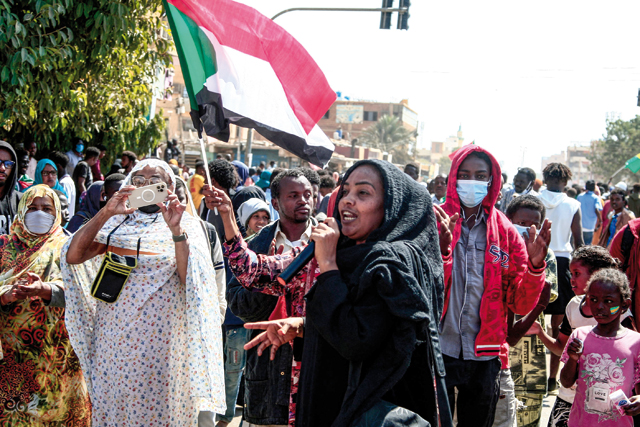 A Sudanese woman speaks during a rally to protest against last year's military coup, in the capital Khartoum, on Sunday (AFP photo)