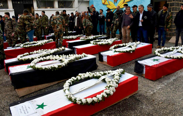 This handout photo released by the official Syrian Arab News Agency (SANA) on Friday shows mourners and soldiers attending the funeral of Syrian army soldiers in the Syrian city of Homs (AFP photo)