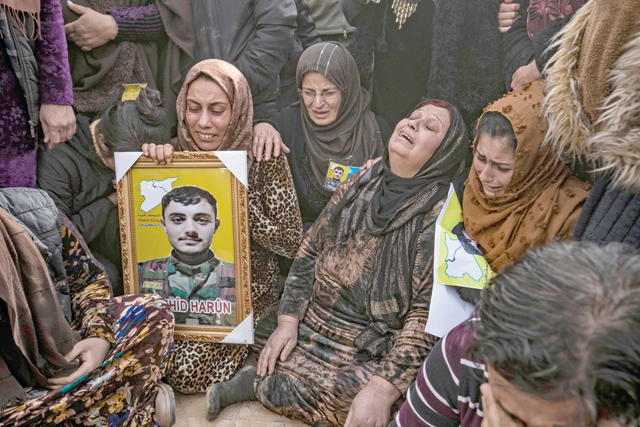 People take part in a funeral in Syria's northeastern city of Hasakeh on Friday, for Syrian Democratic Forces fighters killed in clashes during a jailbreak attempt by the Daesh terror group at the Ghwayran prison in the eponymous province (AFP photo)