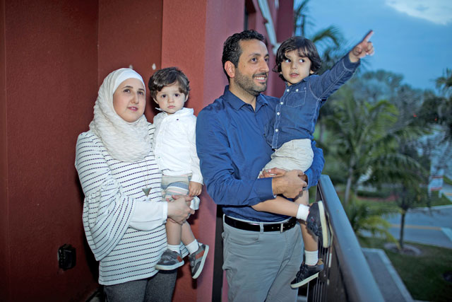 Temporary Protected Status holders Mohammad Alala and his wife Dania, both from Syria, and their two US born children Taim and Amr pose for a photo on the balcony of their home in Miramar, Florida, the US, on Wednesday (Reuters photo)