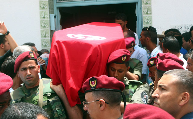 Family, friends and officers carry the Tunisian flag-draped coffin of the head of the paediatric service at the Tunis military hospital, Col. Fathi Bayoudh, one of the victims killed on Tuesday at the blasts in Istanbul’s Ataturk Airport, during his funeral in Ksour Essaf, southern Tunisia, on Friday (AP photo)