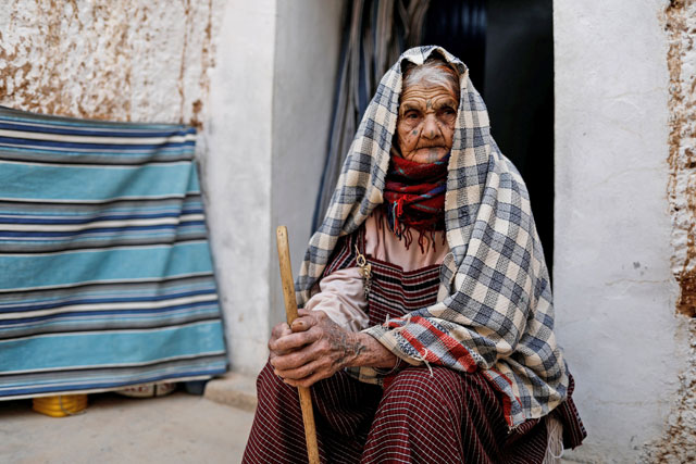 Mariem, 89, sits outside of her troglodyte house on the outskirts of Matmata, Tunisia, on February 4, 2018 (Reuters photo)