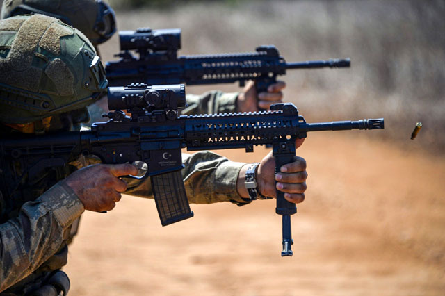 This handout photo released by the Turkish Armed Forces on Monday shows soldiers firing weapons during a military exercise in the self-proclaimed Turkish Republic of Northern Cyprus  (AFP photo)