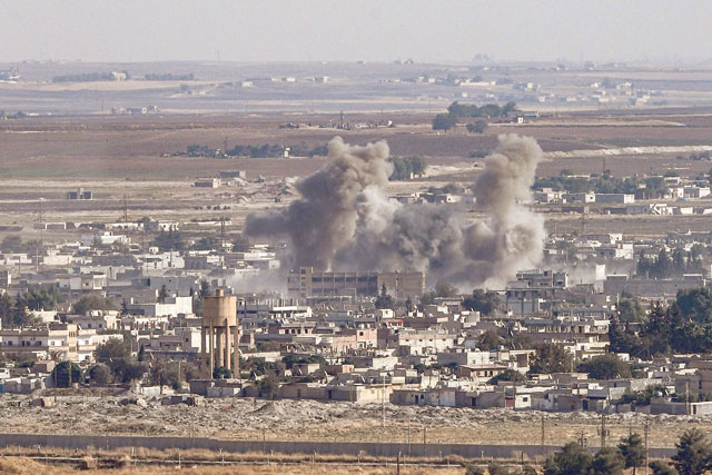 This photo taken on Sunday from the Turkish city of Ceylanpinar shows smoke rising from the Syrian border town of Ras Al Ain as fighting rages along the border on the fifth day of a Turkish offensive in Syria (AFP photo)