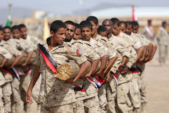 Soldiers loyal to Yemen's President Abed Rabbo Mansour Hadi take part in a parade in the country's northern city of Marib on Sunday (Reuters photo)
