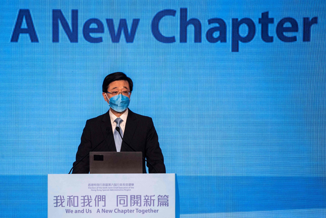 Hong Kong former chief secretary John Lee speaks at an event in Hong Kong on Friday ahead of the Hong Kong chief executive election on Sunday (AFP photo)