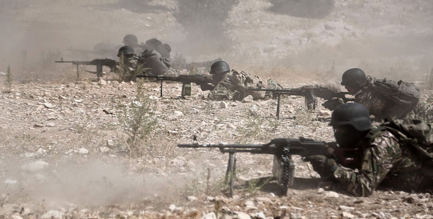 Fighters of the National Liberation Front prepare in anticipation of an attack by the regime on Idlib province and the surrounding countryside, near Idlib, on Monday (AFP photo)