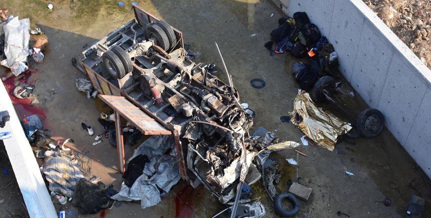Wreckage of a truck, carrying migrants, is photographed after an accident in Izmir, Turkey, on October 14 (Reuters photo)