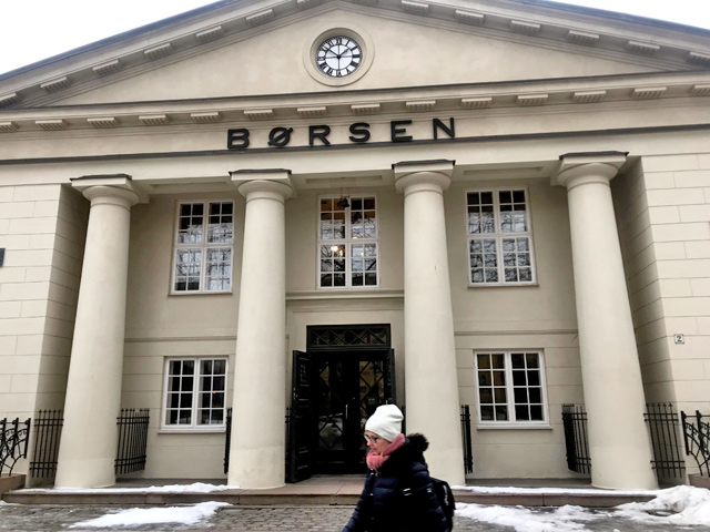 A woman walks past the Oslo Stock Exchange building in Oslo, Norway, on February 12, 2019  (Reuters file photo)