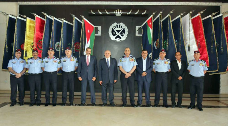   Jordan Press Foundation (JPF) Director General Farid Silwani (fifth from left) with JPF Chairman Ayman Majali (sixth from left) and Public Security Department Director Maj. Gen. Fadel Hmoud (seventh from left) pose for a picture on Thursday (Al Rai photo)