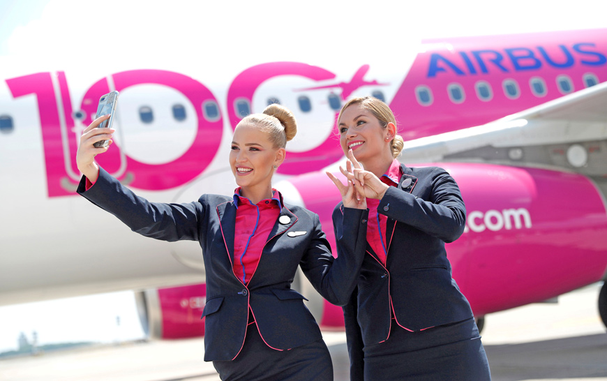 Stewardesses of Wizz Air take a selfie during the unveiling ceremony of the 100th plane of its fleet at Budapest Airport, Hungary, on June 4, 2018  (Reuters file photo)