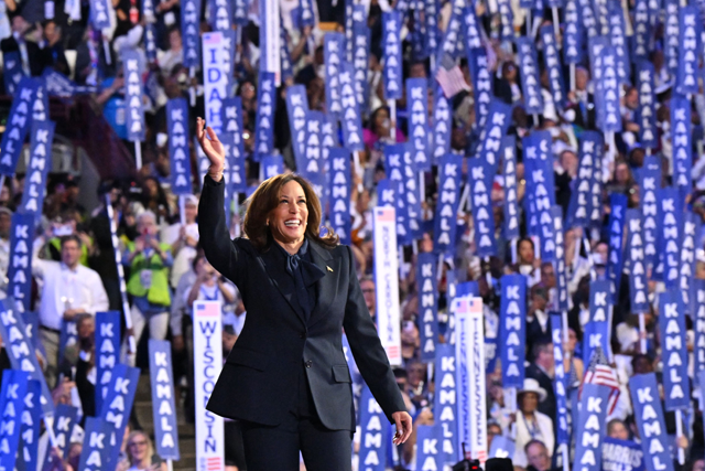 US Vice President and 2024 Democratic presidential candidate Kamala Harris waves as she arrives to speak on the fourth and last day of the Democratic National Convention (DNC) at the United Centre in Chicago, Illinois, on Thursday (AFP photo)