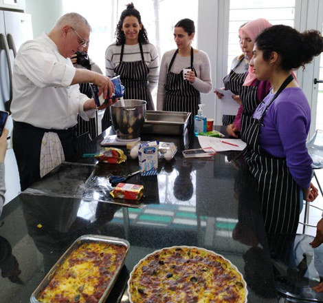   Head chef at the French embassy Alain Benon instructs cooking class participants in French culinary techniques (Photo courtesy of French Institute of Jordan)