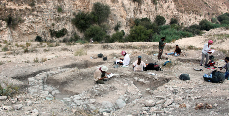 The Wadi Quseiba team excavating an oval-shaped Yarmoukian building in 2018 (Photo courtesy of Kevin Gibbs)