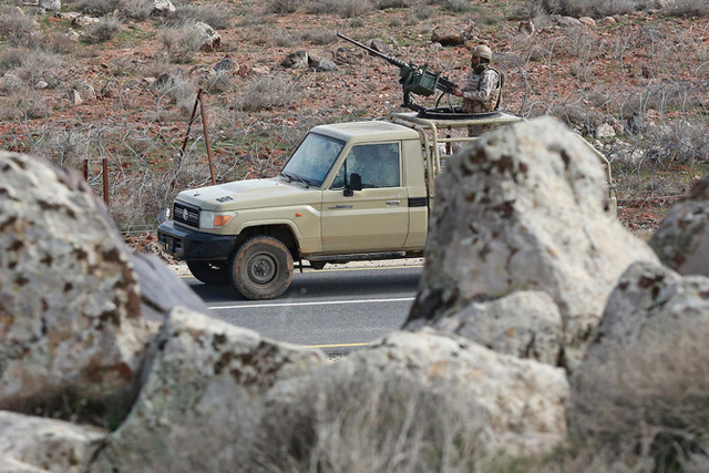 Above, Jordanian army soldiers patrol along the border with Syria to prevent trafficking on February 17, 2022 (AFP photo)