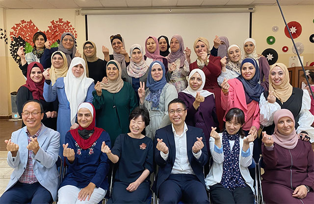Participants pose for a group photo during an event held as part of the Korea International Cooperation Agency’s project, 'Establishment of Special School for Hearing Impaired Students in Marka' (Photo courtesy of KOICA)