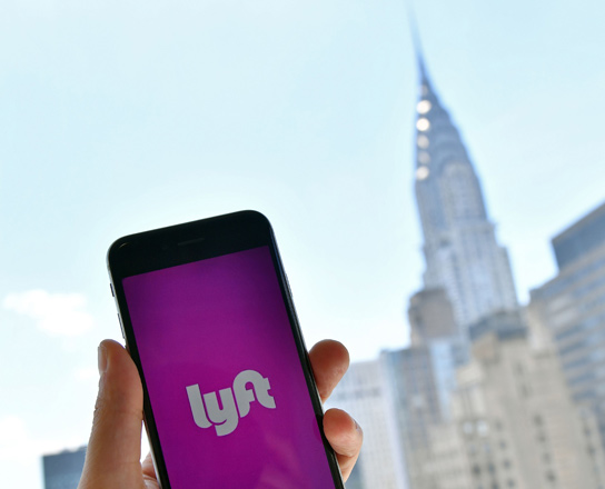  In this file photo taken on June 29, the Lyft transport application is seen on a smart phone in New York City (AFP photo)