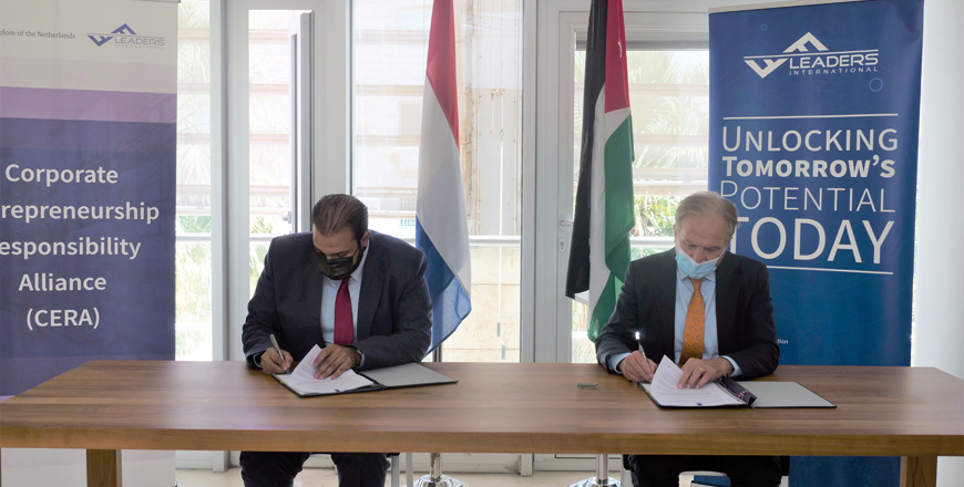 Dolf Hogewoning, acting ambassador of the Embassy of the Kingdom of the Netherlands, and Hamzeh Shamaileh, country manager at Leaders International, sign an agreement (Photo courtesy of Leaders International)