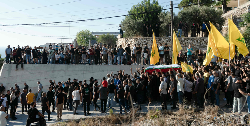 Mourners carry the coffin of Amal Abboud during her funeral in the southern Lebanese village of Adloun on Saturday (AFP photo)