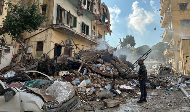 A man checks the destruction at the site of an Israeli air strike targeting a neighbourhood in southern Beirut on Wednesday (AFP photo)