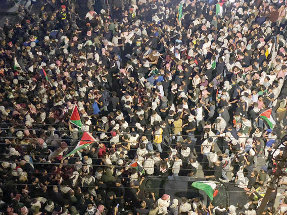 Jordanians protest in the vicinity of the Israeli embassy in Amman following an Israeli air strike on a Gaza hospital compound killing hundreds on Wednesday  (Photo by Osama Aqarbeh)