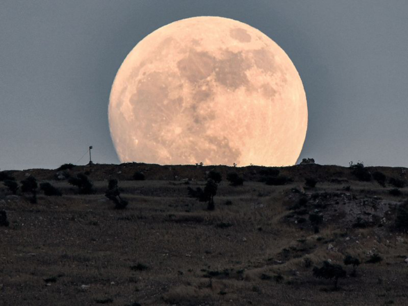 The Mini-Apogee occurs when the full moon coincides with its position near apogee, the farthest point in its elliptical orbit around Earth (JT file)