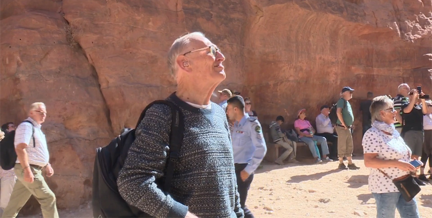 In this undated photo, John Nawafleh surveys the ancient city of Petra. He has made more than 60 visits to the site since 1993 (Photo courtesy of Jordan TV)