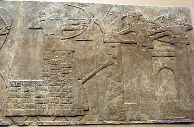 Assyrian attack on a town with archers and a wheeled battering ram; Neo-Assyrian relief, North-West Palace of Nimrud 865–860 BC  (Photo of Encyclopædia Britannica)