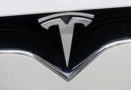 In this  photo taken on December 20, 2016, the Tesla logo is seen in Washington, DC  (AFP file photo)