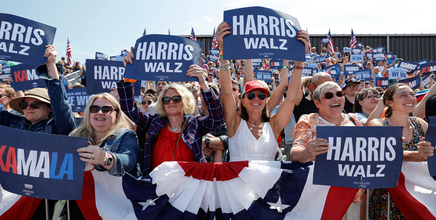 ttendees hold signs as US Vice President and 2024 Democratic presidential candidate Kamala Harris and her running mate Minnesota Governor Tim Walz speak during a campaign rally in Eau Claire, Wisconsin, on Wednesday (AFP photo(