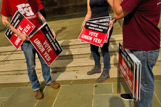 In this file photo taken on March 27, 2021, people hold 'Vote Union Yes!' signs during a protest in solidarity with Black Lives Matter, Stop Asian Hate and the unionization of Amazon fulfillment center workers at Kelly Ingram Park in Birmingham, Alabama (AFP photo)