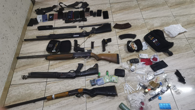 Firearms, drugs and other items are displayed by authorities following drug raids in Aqaba, Irbid, Amman, Ramtha and Mafraq over the past several days (Petra photo)