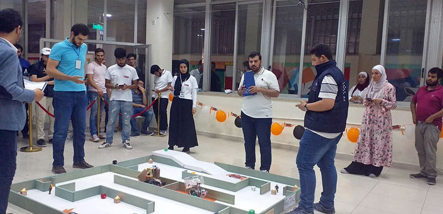 Students and their robots at the Institute of Electrical and Electronics Engineers Robotics and Automation Society’s competition at the University of Jordan on Saturday (Photo courtesy of IEEE RAS)