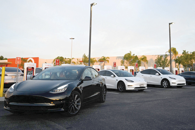 Tesla, Inc. electric vehicles charge at supercharger location in Hawthorne, California, on Wednesday (AFP photo)