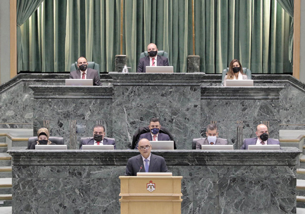 Prime Minister and Minister of Defence Bisher Al Khasawneh delivers the Cabinet’s policy statement to the Lower House during a session headed by House Speaker Abdulmunim Oddat on Sunday (Petra photo)