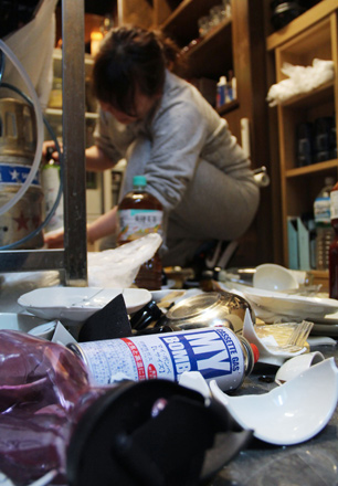 Tableware and dishes are seen broken on the floor of a restaurant in Fukushima early on February 14, 2021 after a 7.1-magnitude earthquake struck late on Saturday off the eastern coast of Japan (AFP photo)