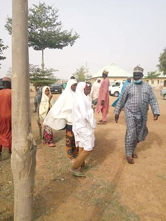 Parents arrive at the school compound in search of children kidnapped by bandits in Jangede, Zamfara State in northwest Nigeria, on Friday (AFP photo)