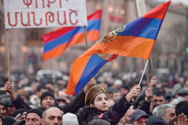 Supporters of Armenian Prime Minister Nikol Pashinyan rally at Republic Square in downtown Yerevan on Monday (AFP photo)