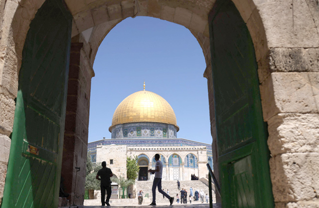 Palestinian Muslim worshippers walk in Jerusalem's Al Aqsa Mosque compound, the third holiest site of Islam, on Friday (AFP photo)