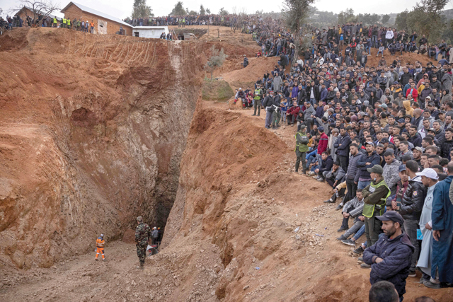 Bystanders watch as Moroccan emergency teams work to rescue five-year-old boy Rayan from a well shaft he fell into on February 1, in the remote village of Ighrane in the rural northern province of Chefchaouen, on Friday (AFP photo)