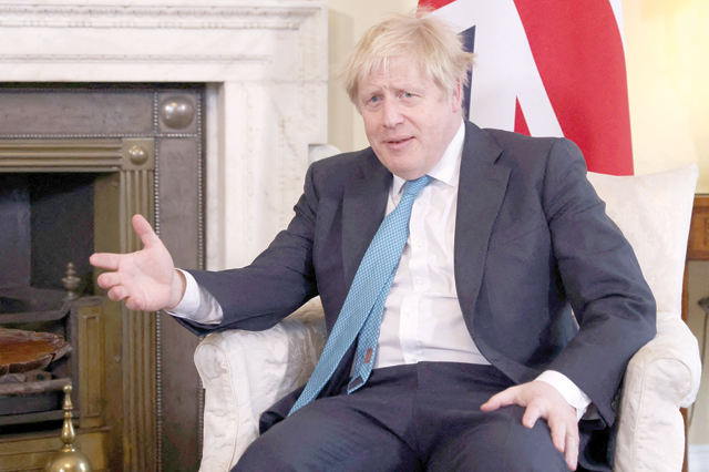 Britain's Prime Minister Boris Johnson reacts during his meeting with Lithuania's prime minister inside 10 Downing Street in central London on Tuesday (AFP photo)