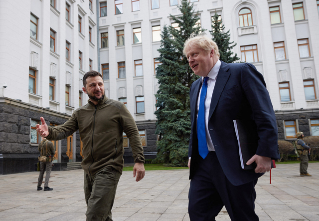 This handout photo taken and released on Saturday by Ukrainian Presidential Press Service shows Ukrainian President Volodymyr Zelensky welcoming British Prime Minister Boris Johnson ahead of their meeting in Kyiv (AFP photo/ukrainian presidential press service)
