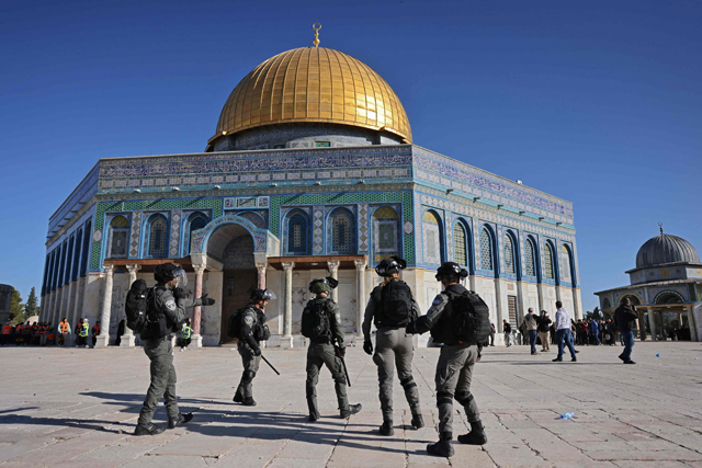 Israeli forces patrol in front of the Dome of the Rock mosque during confrontations with Palestinians at Jerusalem's Al Aqsa Mosque compound on Friday (AFP photo)